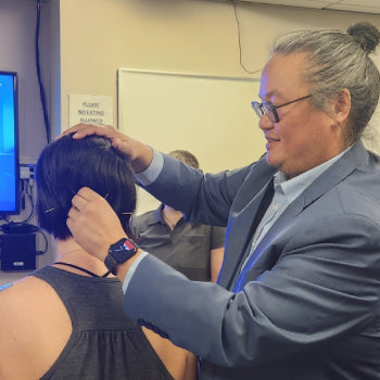 Dr Clayton Shiu demonstrating Nanopuncture neurological acupuncture technique